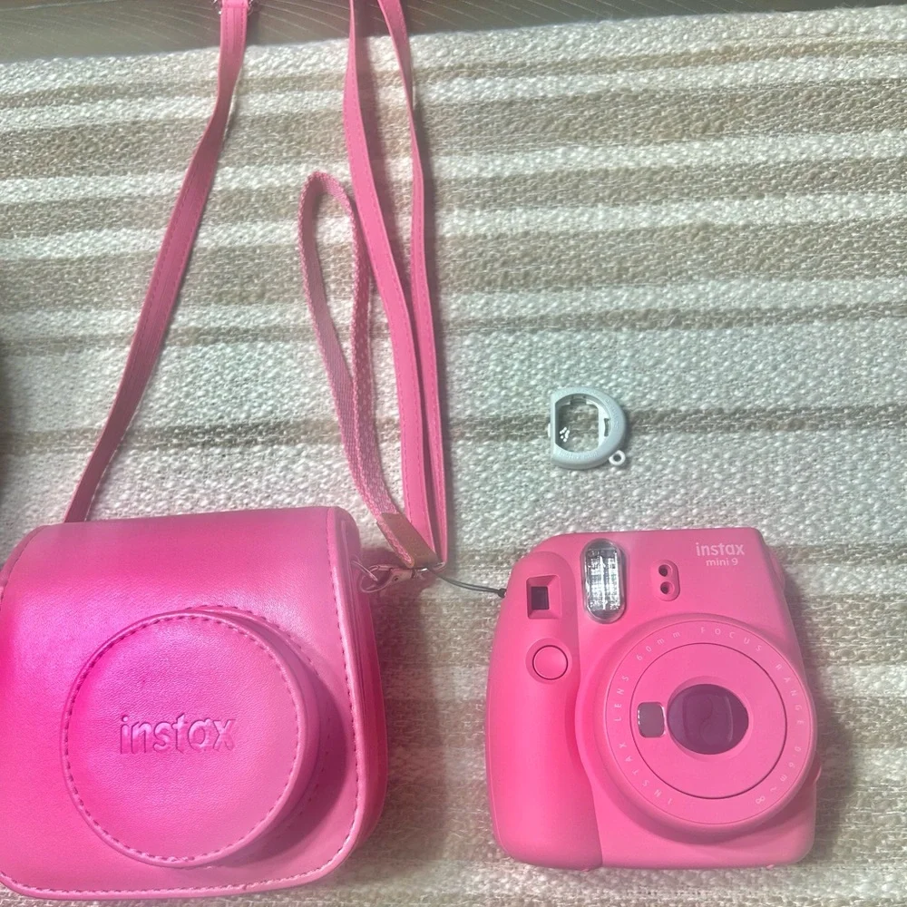 Insta mini 9, the matching traveling case, and a lense